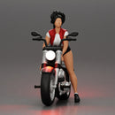 attractive girl on the motorbike in shorts and a mini jacket with curly hair - Only-Games