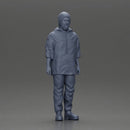 man wearing a hat and hoodie stands confidently watching intently - Only-Games