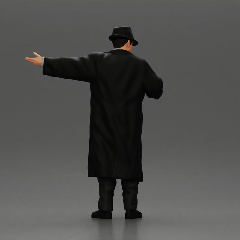 mafia man in gangster costume stands confidently while gesturing with his hands as if presenting something