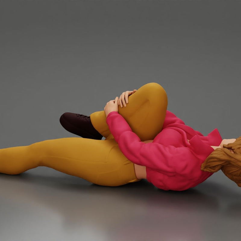 woman in mini jacket  lying on the floor touching her injured knee