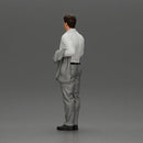 business man standing Holding a Suit - Only-Games