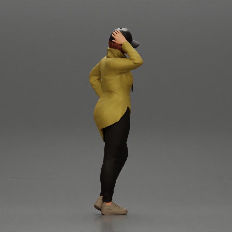 Asian girl in a neck hoodie and cap is standing and thinking