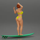 young girl posing and riding on the surfboard at the beach - Only-Games