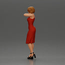 beautiful girl in a mini dress and heels with short hair places her hand on her neck - Only-Games