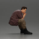 Thoughtful Man Squatting in Casual Outfit, Deep in Contemplation - Only-Games