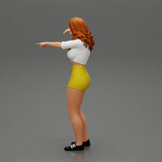 Travel woman in short pointing her next destination using world map - Only-Games