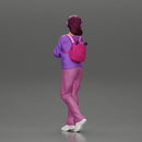 young woman listening to music with headphones and carrying a backpack - Only-Games