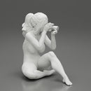 Woman photographer in bikini sitting and holding a camera - Only-Games