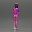 young woman listening to music with headphones and carrying a backpack - Only-Games