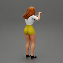 Travel woman in short pointing her next destination using world map - Only-Games