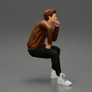 man in leather jacket sitting in thinking pose - Only-Games