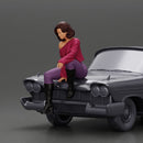 lowrider girl sitting on a car, wearing boots and a stylish shirt - Only-Games