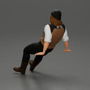 Man in Vintage Outfit and bonnet Seated in a Relaxed Pose - Only-Games