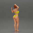 young girl posing and riding on the surfboard at the beach - Only-Games