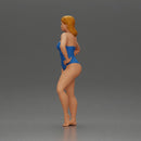 Elegant pose in blue swimsuit showcasing confidence and grace - Only-Games