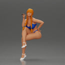 Woman sitting  with Pigtails wearing bikini smoking cigarette with contemplative gaze - Only-Games