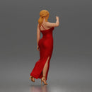 Elegant woman in sleeveless evening dress with side slit