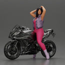 Bold Woman in Pink Jumpsuit Posing on a Sleek Motorcycle - Only-Games