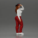 woman in red pants striking stylish pose with hat - Only-Games