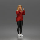woman pointing upward wearing off shoulder shirt leggings sneakers