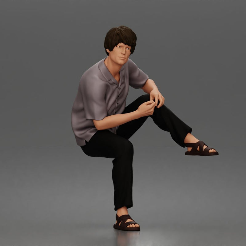 Man Sitting With Knee Bent In Shirt Trousers And Sandals