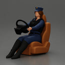 Focused officer in blue uniform driving seated holding steering wheel - Only-Games