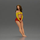 Woman in yellow top and red shorts leaning to wall - Only-Games