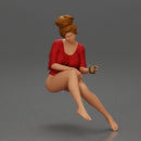 Relaxed girl in red sipping coffee enjoying a peaceful moment on the beach - Only-Games