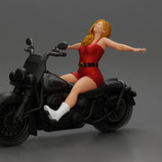 Woman in red outfit stretching arms wide while sitting on motorcycle - Only-Games