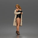 Woman Posing In Strapless Bodysuit With Long Coat And High Heel Sandals