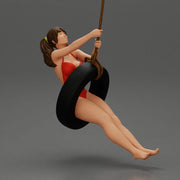 Sexy Girl in onepiece Enjoying a Fun Swinging Adventure on Tire - Only-Games