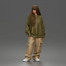 Girl Standing In Oversized Sweatshirt Cargo Pants And Sneakers