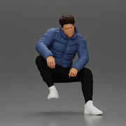 Street performer crouching low in blue puffer jacket athletic stance sitting - Only-Games