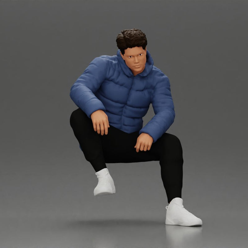 Street performer crouching low in blue puffer jacket athletic stance sitting - Only-Games