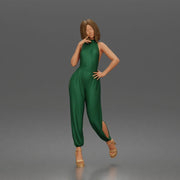 Woman poses thoughtfully lifting heel wearing halter jumpsuit with platform heels - Only-Games