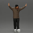 Man wearing hoodie and beanie raises hands looking happy in relaxed stance - Only-Games