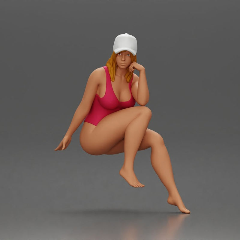 Woman in Swimsuit and Cap Sitting Thoughtfully in Relaxed Pose - Only-Games