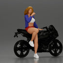 Confident woman sitting gracefully on a sleek modern sportbike - Only-Games
