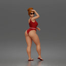 Standing woman shields eyes wearing swimsuit sunglasses earrings flip flops