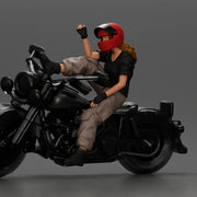 Biker woman in red helmet striking pose on black motorcycle - Only-Games