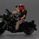 Biker woman in red helmet striking pose on black motorcycle - Only-Games