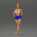 woman posing barefoot wearing bikini top and shorts stylishly - Only-Games