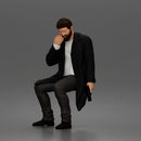 Seated Detective In Long Coat Holding Weapon In Contemplative Pose
