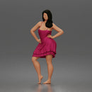woman posing with hands on hips wearing ruffled dress