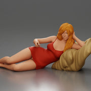 Woman lounges atop pillow watching television holding remote wearing slip dress - Only-Games