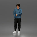 Casual Young Man Standing Relaxed in Hoodie, Joggers, and Sneakers