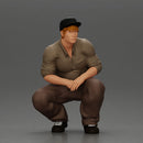 Gangster man crouching in a relaxed pose wearing casual clothing and cap - Only-Games