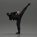 Ninja in black uniform performs high side kick with precision - Only-Games