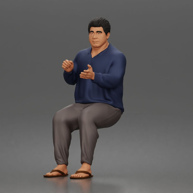 Asian Man sits gesturing while wearing casual sweater pants flip flops comfortably - Only-Games