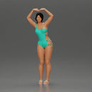 Brunette woman in turquoise swimsuit stretching with elegant ballet pose - Only-Games